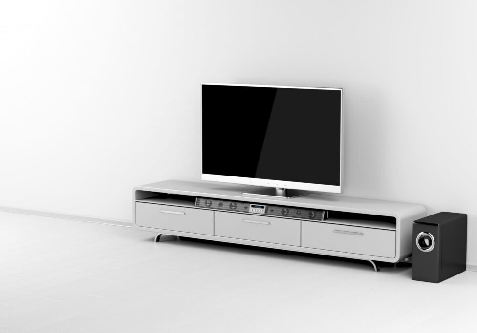 a flat screen tv sitting on top of a white entertainment center